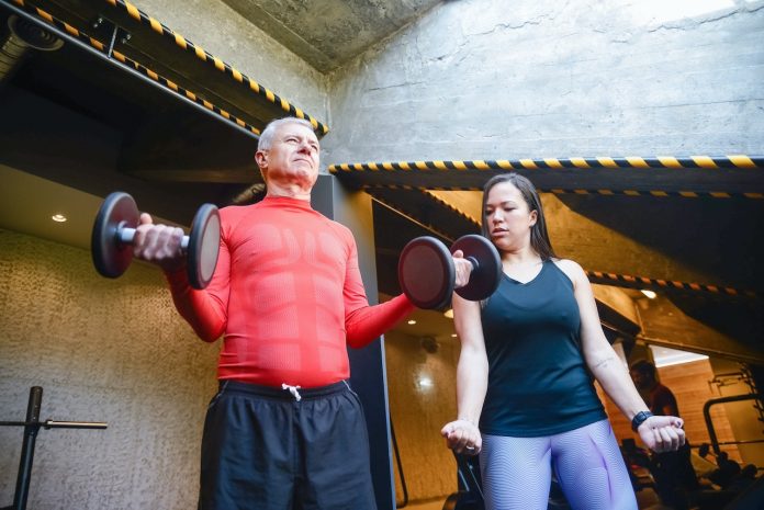 old person doing weight training