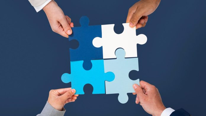 hands holding jigsaw puzzle