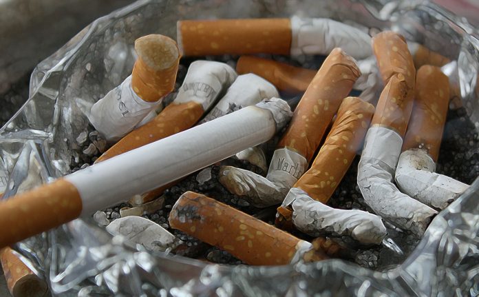 Many cigarette butts in an ashtray