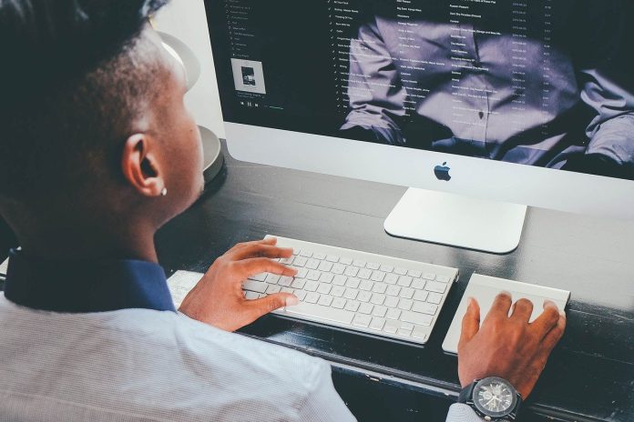 man staring at computer screen
