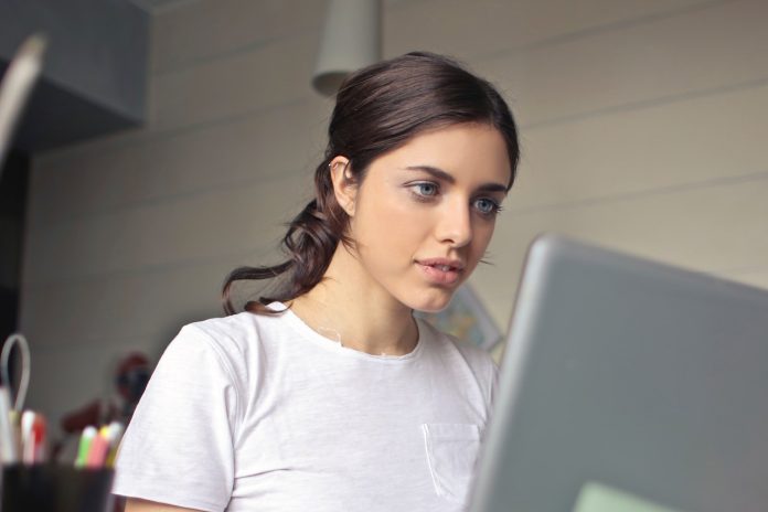 woman staring at a computer screen
