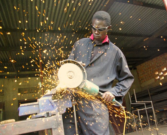 angle grinder worker in workshop