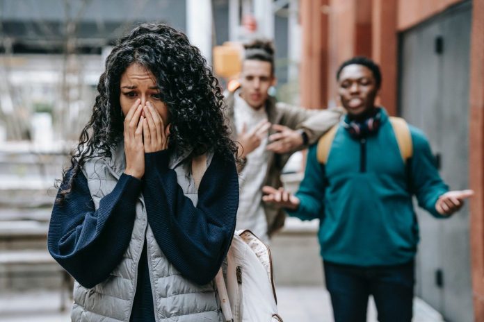 young lady covering her mouth