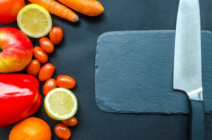 carotenoids on table with chopping board and knife