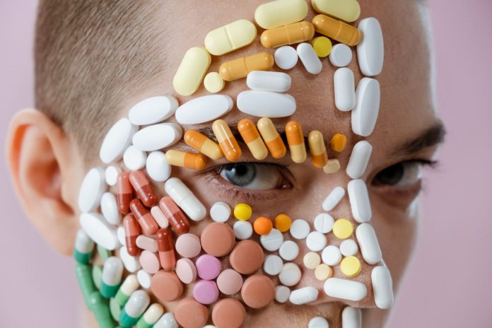 medicine pills stuck to a person's face