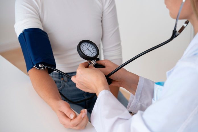 doctor measuring blood pressure