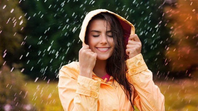 young woman wearing a jacket in the rain