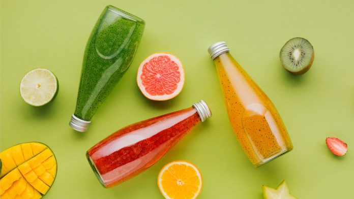 colourful juice bottles with fruit slices