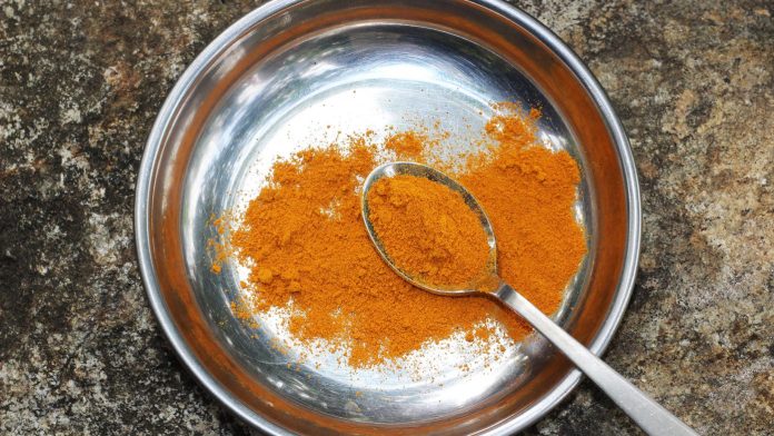 turmeric powder in a steel plate